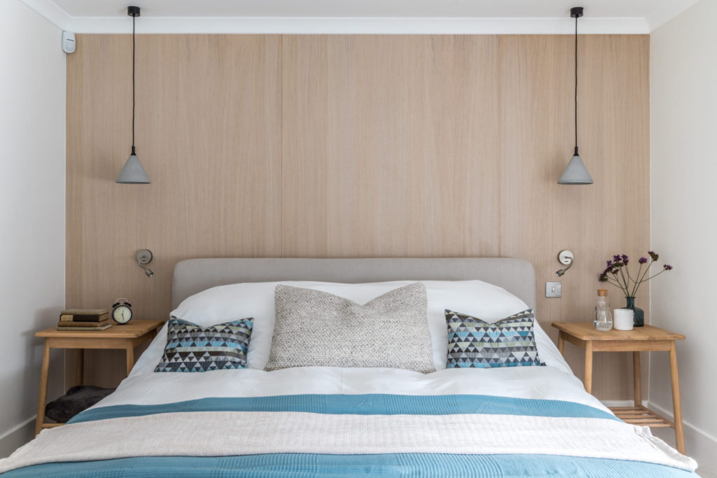 calm scandi style bedroom with natural wood panelling
