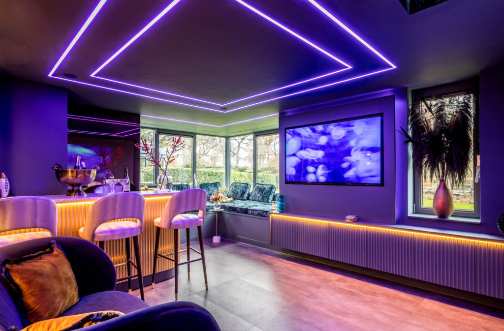 home bar and games room design with LED ceiling lights, panelling and space for entertaining