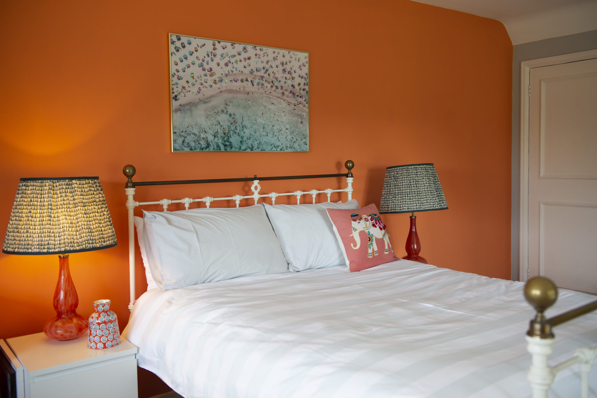 Colourful bedroom in classic sussex farmhouse